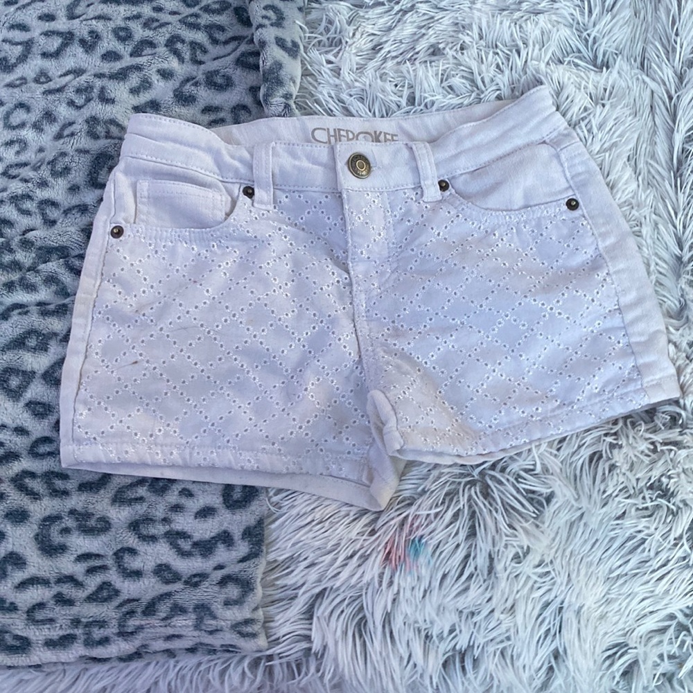white pleaded shorts